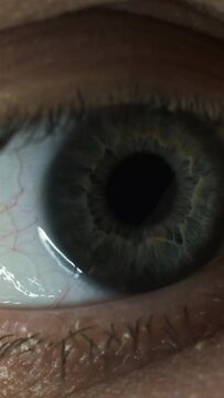 The close up macro view of human eye. slow motion