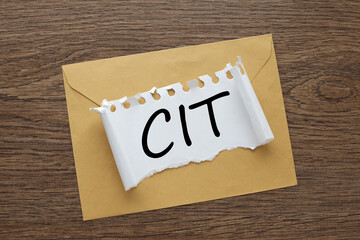 CIT torn page with word on envelope. working table