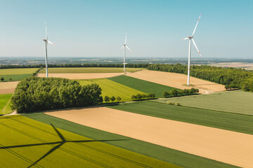 landscape with wind turbines in agricultural fields