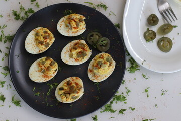 Stuffed eggs. Hard boiled eggs cut into half and stuffed with a paste made with egg yoks, mixed with mayonnaise and mustard
