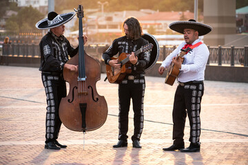 Mexican musician mariachi band on a city street.