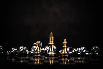 King chess pieces stand win with teamwork on falling chess concept of team player or business team...