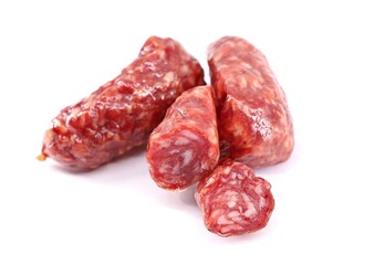 Wild boar salami on white background.