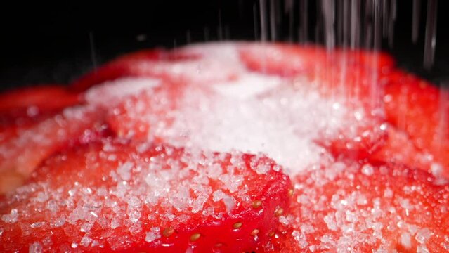 Diced ripe strawberries sprinkled with sugar. Dolly shot