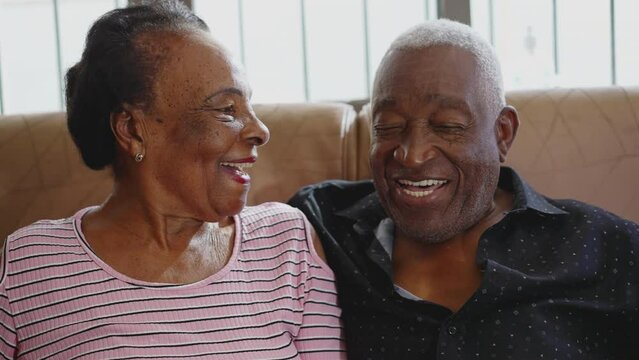 Senior couple kissing, a black Brazilian older husband and wife kiss, loving and caring relationship at old age
