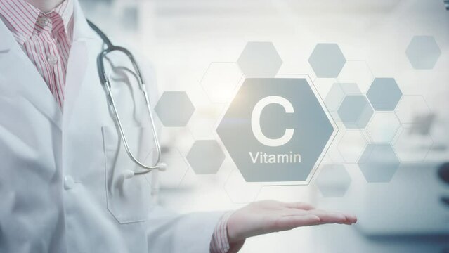 Pharmacy expert doctor showing symbol for the Vitamin C. Clean abstract commercial background