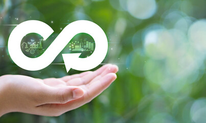 Human Hand Showing Arrow Infinity Symbol The circular economy is infinite and unlimited for future...