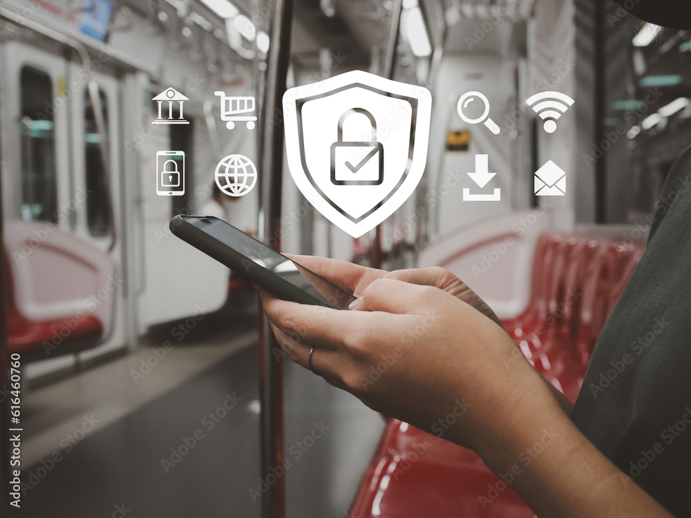 Wall mural cyber security, businessman using smartphone security to protect business data through a secure inte