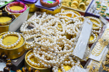 Many bracelets made of artificial pearls in vietnamese market