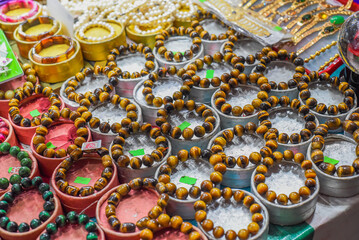 Many bodhi tree rosary bracelets with wooden beads in the vietnamese market