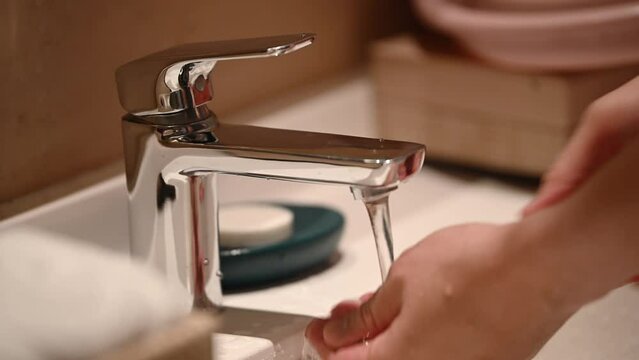 People are washing their hands with clean water. Wash your hands to keep them clean and prevent the spread of viruses.