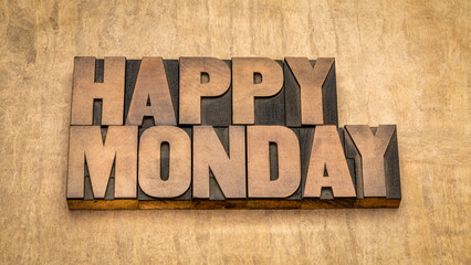 Happy Monday word abstract in vintage letterpress wood type against textured handmade paper, cheerful greetings © MarekPhotoDesign.com