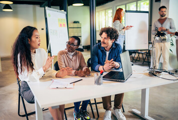 Coworkers talking about serious topics on their job in the office