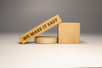 The sentence We make it easy was written. Wooden concept studio shoot.