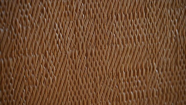 closeup view of brown wicker pattern background texture wooden furniture detail straw handcrafted decoration