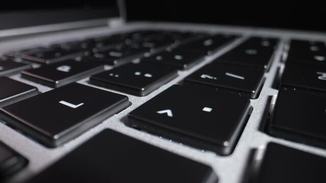 Laptop keyboard close up. Dolly shot