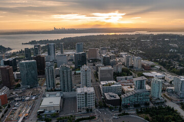 Naklejka na ściany i meble The City of Bellevue in Washington State Sunset With Dowtown Highrise in View from Above Drone Aerial Shot