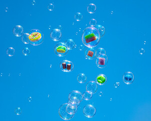 sweets floating in soap bubbles in the air