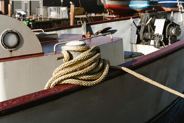 Mooring rope and bollard at the harbor. Marine rope