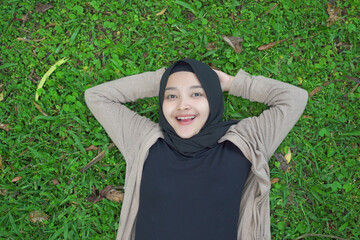 hijab women are relaxing enjoying the atmosphere in the garden