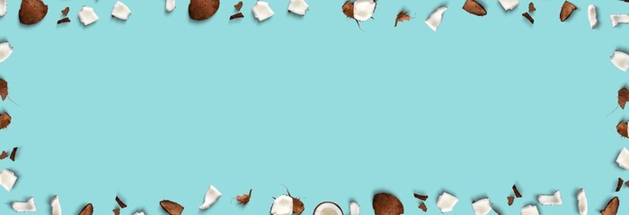 Pattern with ripe coconuts on blue background. Top View. Copy Space. Pop art design, creative summer concept. Banner. Tropical abstract coconut pattern in a minimal flat lay style
