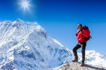 Hiker on the top in Himalayas mountains. Travel sport lifestyle concept