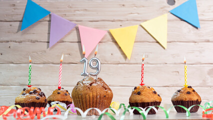 Festive birthday cakes with candles. Birthday background with numbers  19. Anniversary cards on a...