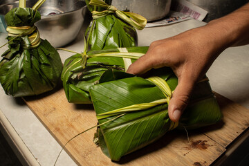 THE JUANE, TYPICAL FOOD OF THE PERUVIAN AMAZON, IS CONSUMED IN THE TRADITIONAL CELEBRATION OF SAN...