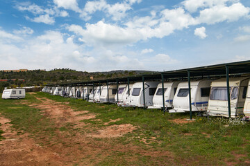 Fototapeta na wymiar Dethleffs camping trailer for sale Caravan trailers parked