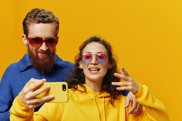 Woman and man funny couple with phones hand social networking and communication crooked do selfies...