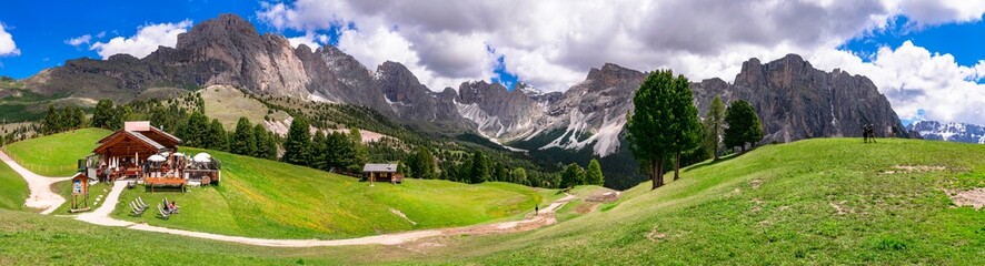 Breathtaking panorama of beautiful Alps mountains Dolomites, Val Gardena ski resort in south Tyrol in northern Italy. Alpine nature scenery - obrazy, fototapety, plakaty