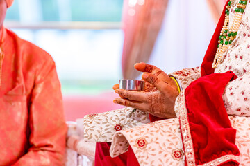 Fototapeta na wymiar Indian Hindu wedding ritual hands close up