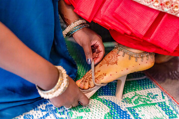 Indian bride's wedding shoes close up