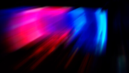 Bright dynamic diagonal spots on black, abstract blurred background.