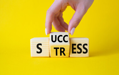 Success vs Stress symbol. Businessman hand turns wooden cubes and changes the word Stress to Success. Beautiful yellow background. Success vs Stress and business concept. Copy space