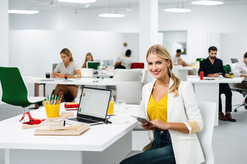 Photo of a businesswoman working at her desk in a modern office