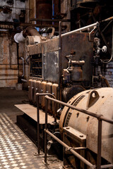 Fototapeta na wymiar Old machinery in an abandoned factory.