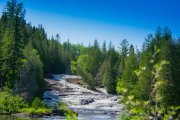 Fototapeta na wymiar Waterfalls on a beautiful wild river in Quebec in Canada