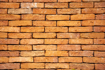 Old grunge red brick wall background, close up texture