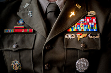 Photograph of a U.S. Army chaplain's in uniform, with lapel cross sparkling in sunlight.