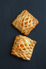 Puff pastry with fruit filling decorated with mesh on top. View from above
