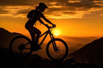 Fototapeta premium A low angle, her silhouette framed against the sunset, mountain bike by her side. Generative AI