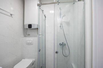 Bathroom interior with glass shower cabin