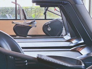 A view of several cardio fitness machines.