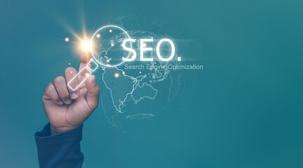 Search Engine optimization (SEO) concept, Businessman using finger pointing to magnifier icon for...