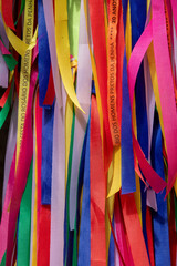 closeup of multicolored ribbons tied to a pole symbolizing the desires and requests of the devotees of Nossa Senhora dos Pretos in the Penha neighborhood, São Paulo, Brazil