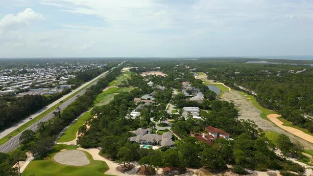Aerial video Hobe Sound railroad tracks seperating upper class from lower neighborhoods