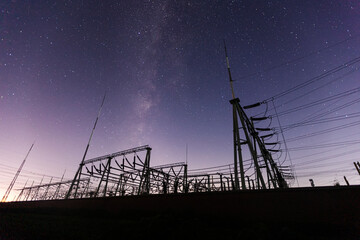 pylon and the Milky Way, The high voltage substation is under the stars - obrazy, fototapety, plakaty