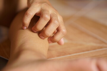 Woman having itchy skin on legs