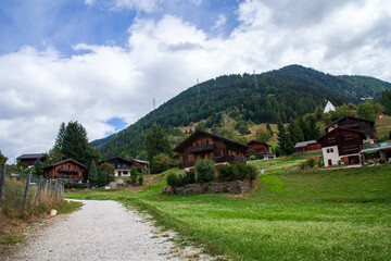 Fototapeta na wymiar Mountain village in the Swiss Alps on a sunny summer day.